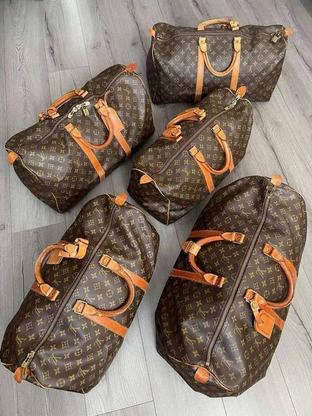 Five Louis Vuitton Keepall bags in Monogram